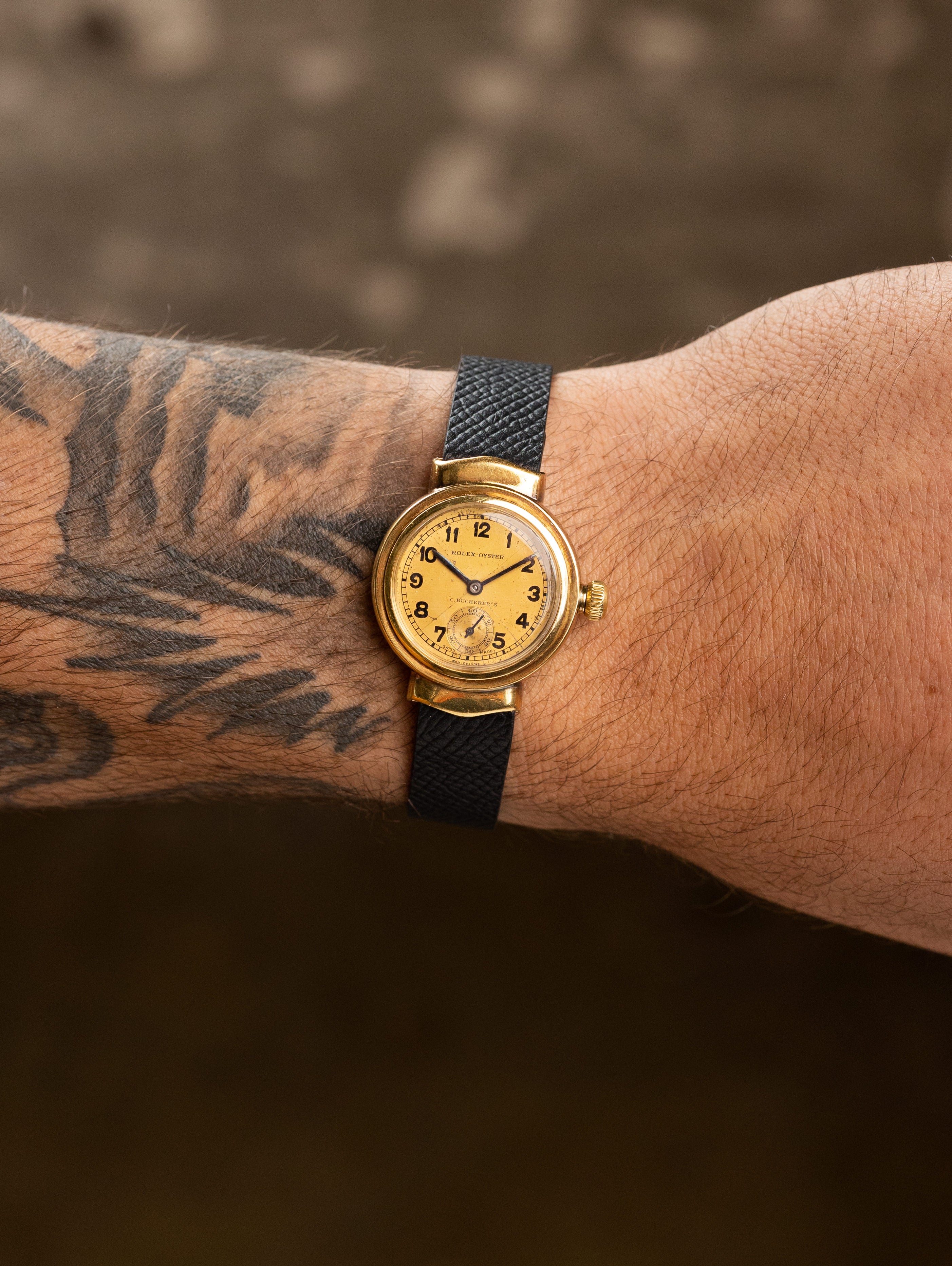 Rolex Oyster 'Hooded Lug' - Champagne 'Bow Tie' Dial 'C. Bucherer's' Signature