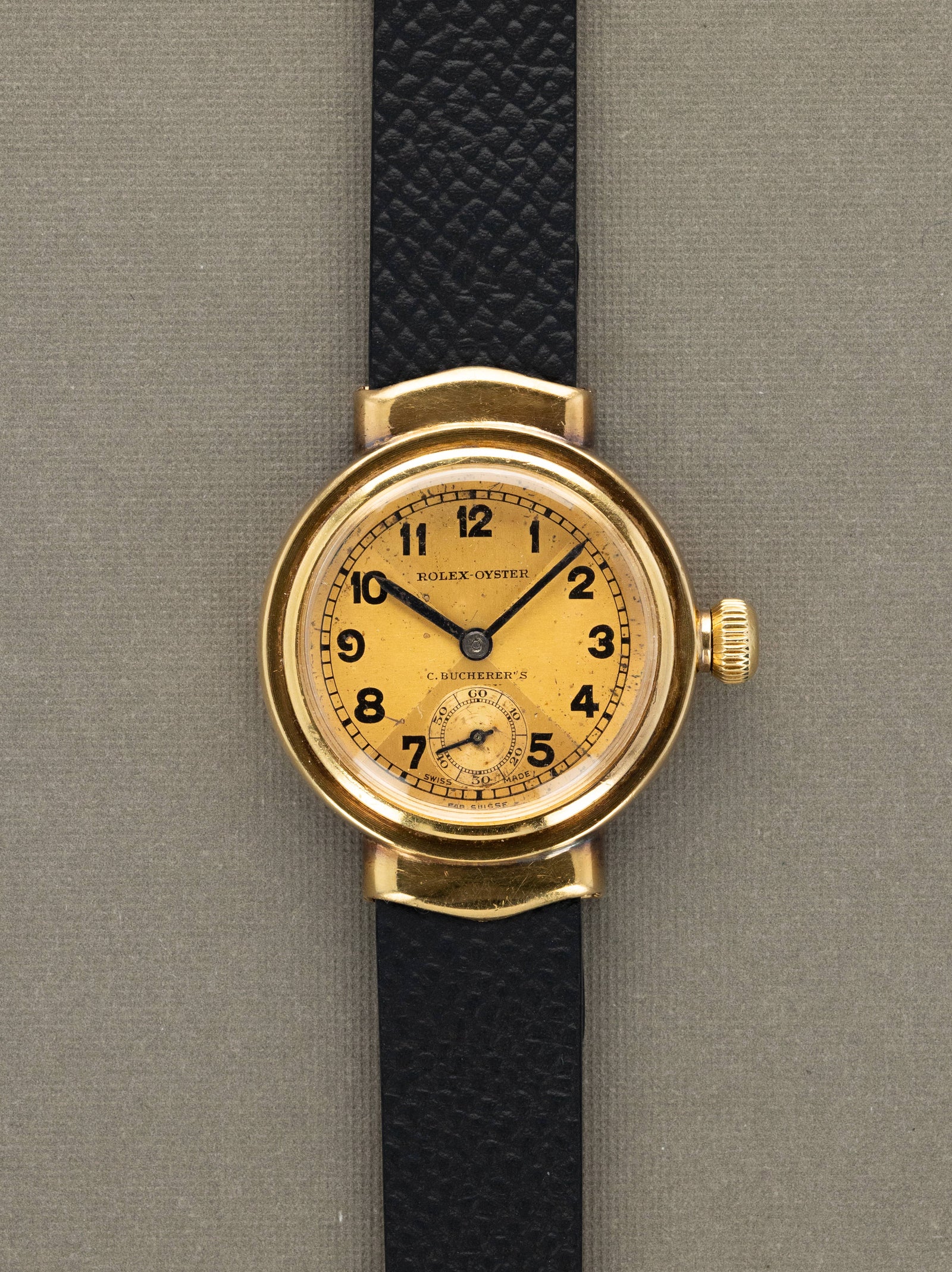 Rolex Oyster 'Hooded Lug' - Champagne 'Bow Tie' Dial 'C. Bucherer's' Signature