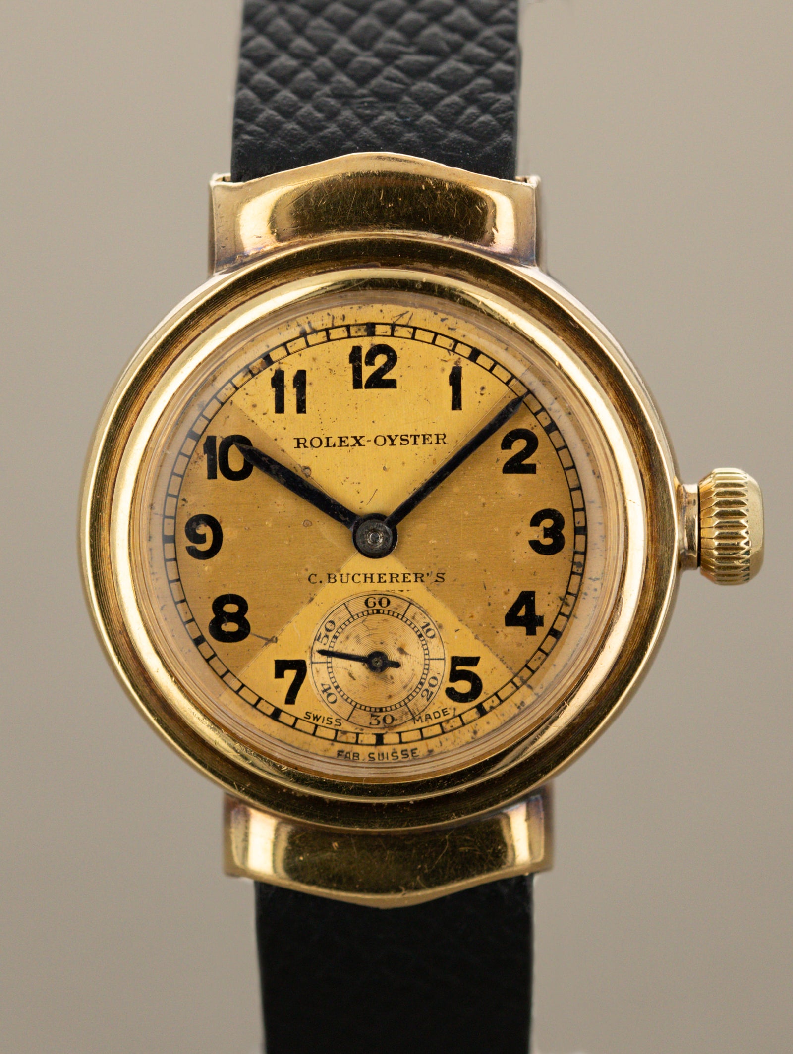Rolex Oyster 'Hooded Lug' - Champagne 'Bow Tie' Dial 'C. Bucherer's' Signature