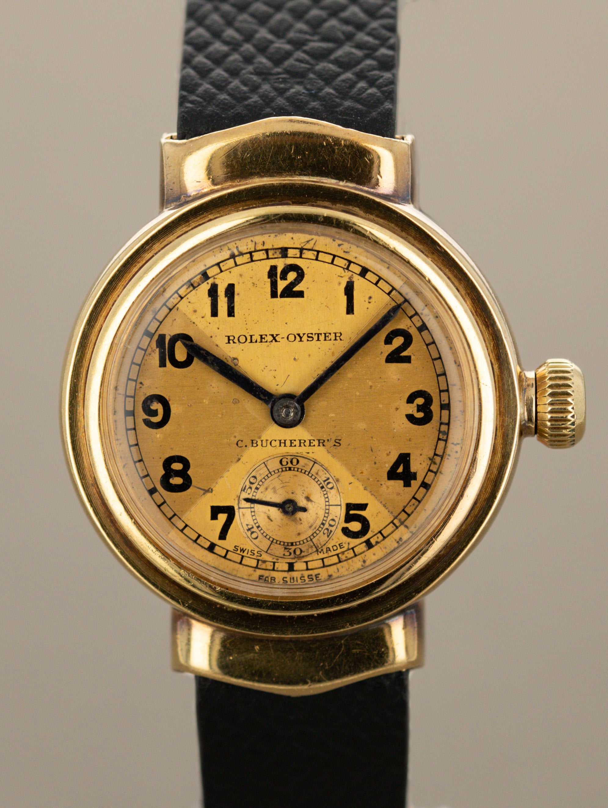 Rolex Oyster 'Hooded Lug' - Champagne 'Bow Tie' Dial 'C. Bucherer's' Signature