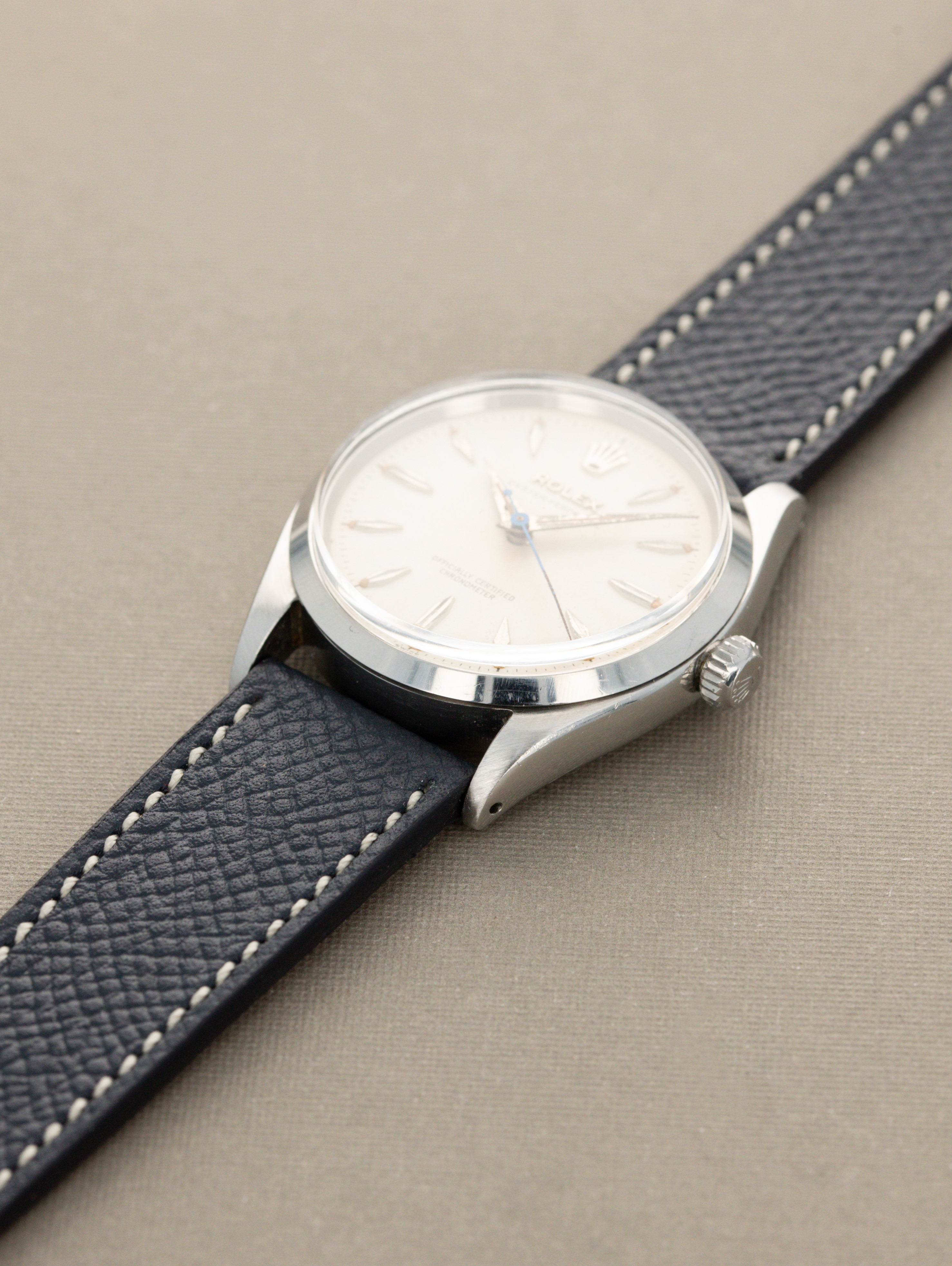 Rolex Oyster Perpetual Ref. 6564 - 'Satin' White Patina Dial